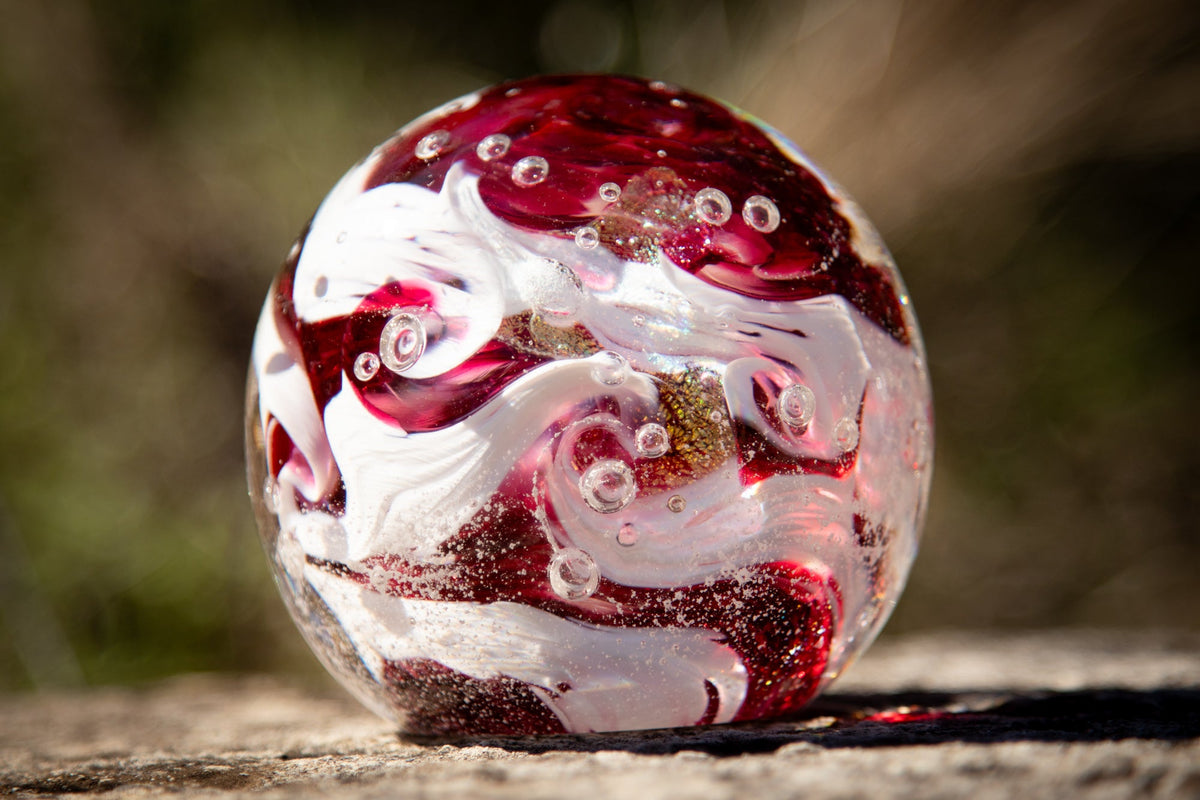 Glass orbs with cremation ash