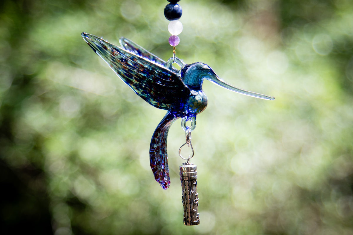 hummingbird with silver keepsake pendant
